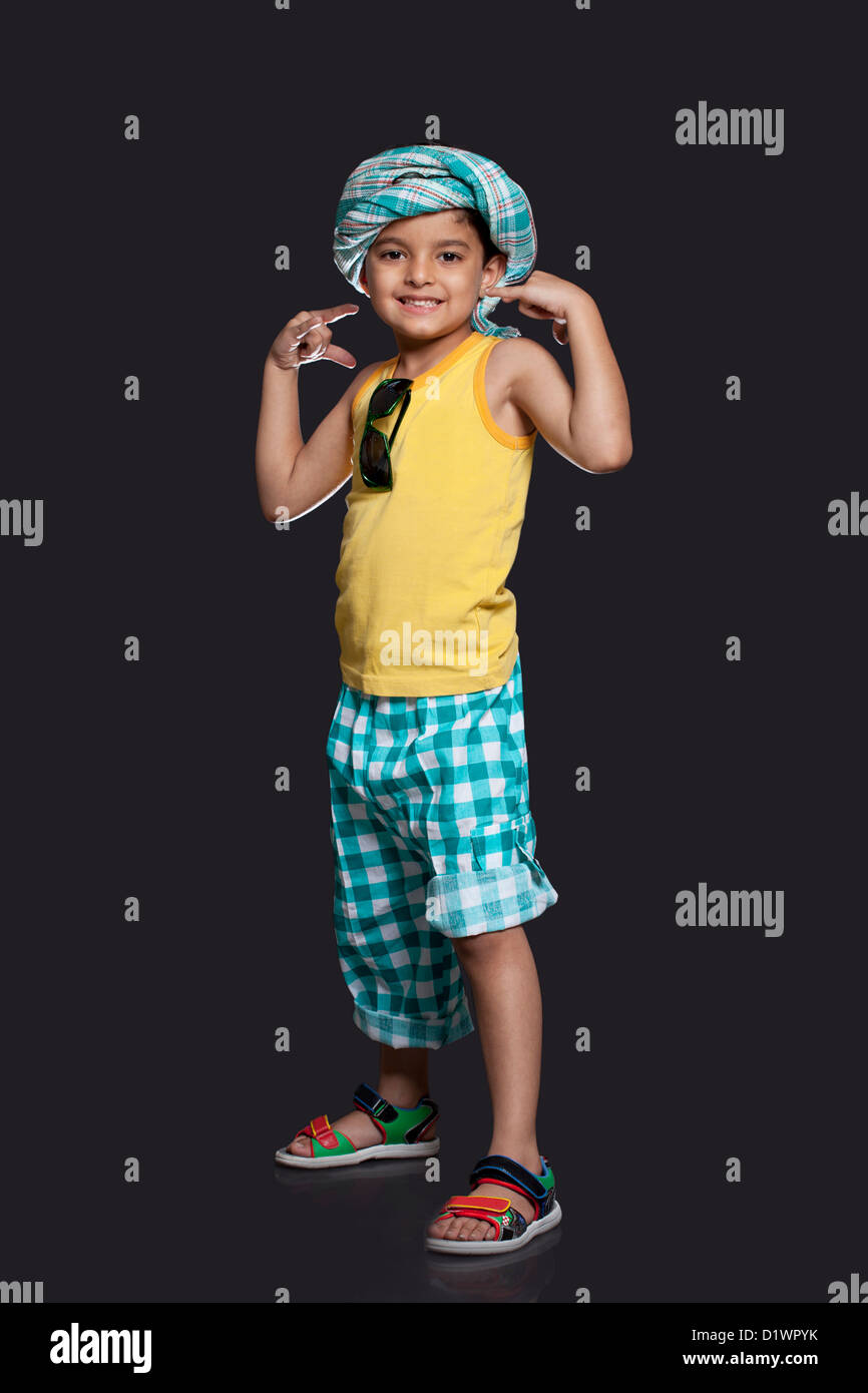 Portrait of boy over black background Stock Photo