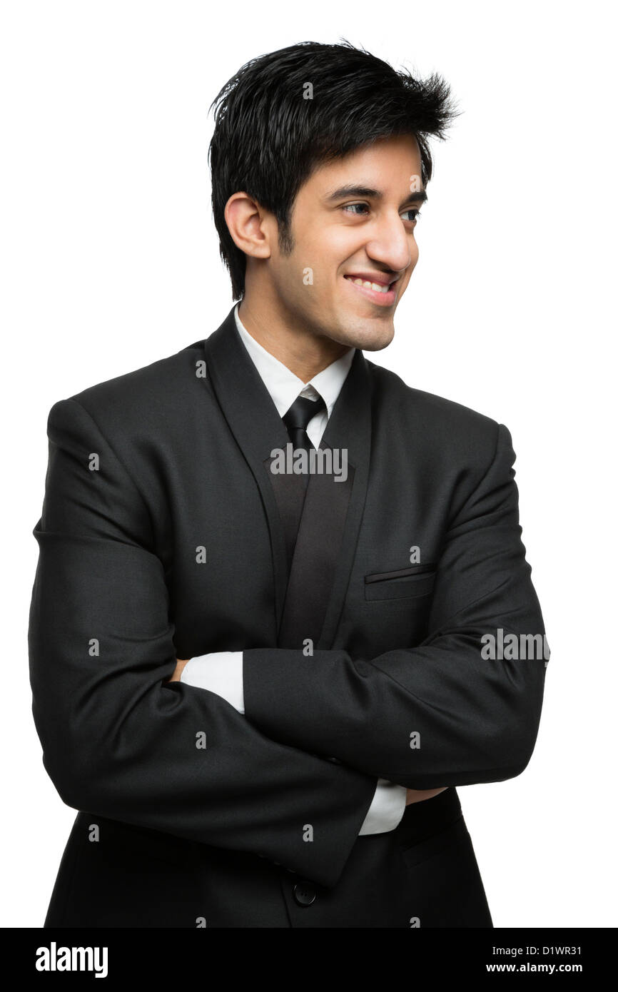 Businessman standing with arms crossed and smiling Stock Photo - Alamy