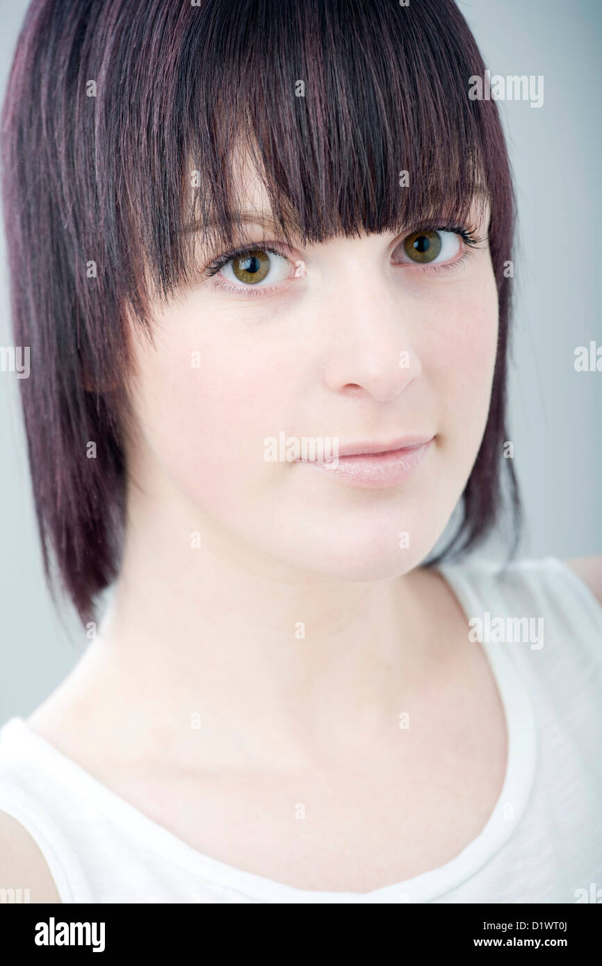 Portrait Of A Young Woman With Short Hair And A Fringe Stock Photo