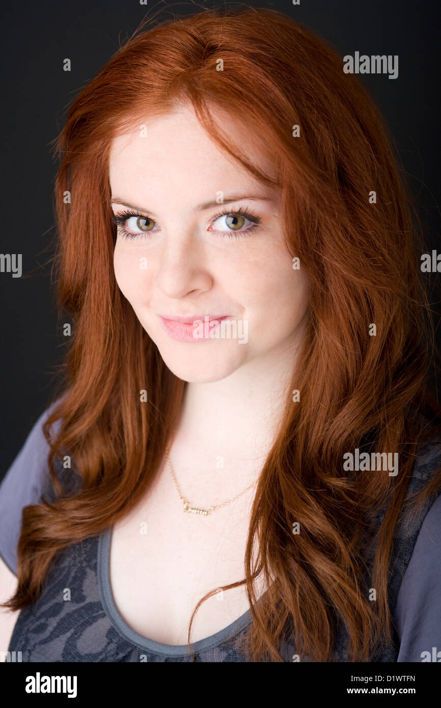 Portrait of a young woman with bright red hair Stock Photo - Alamy