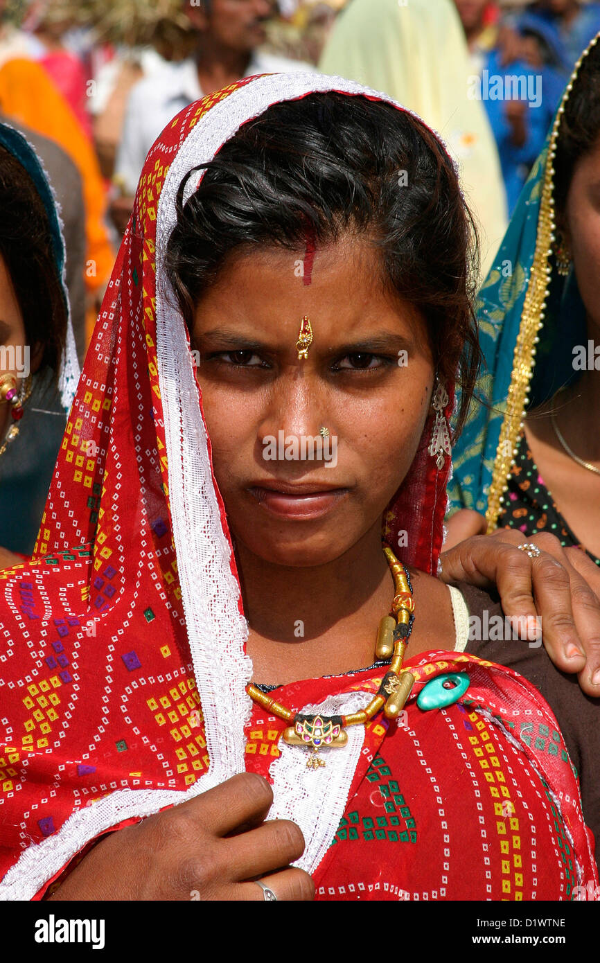 Portrait of a beautiful Rajasthani woman wearing traditional colourful ...