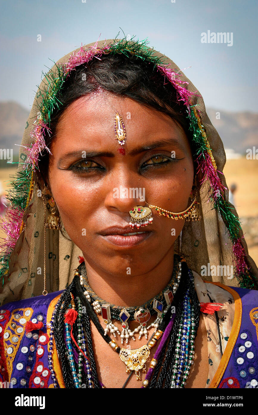 Portrait of a beautiful Rajasthani woman wearing traditional colourful ...
