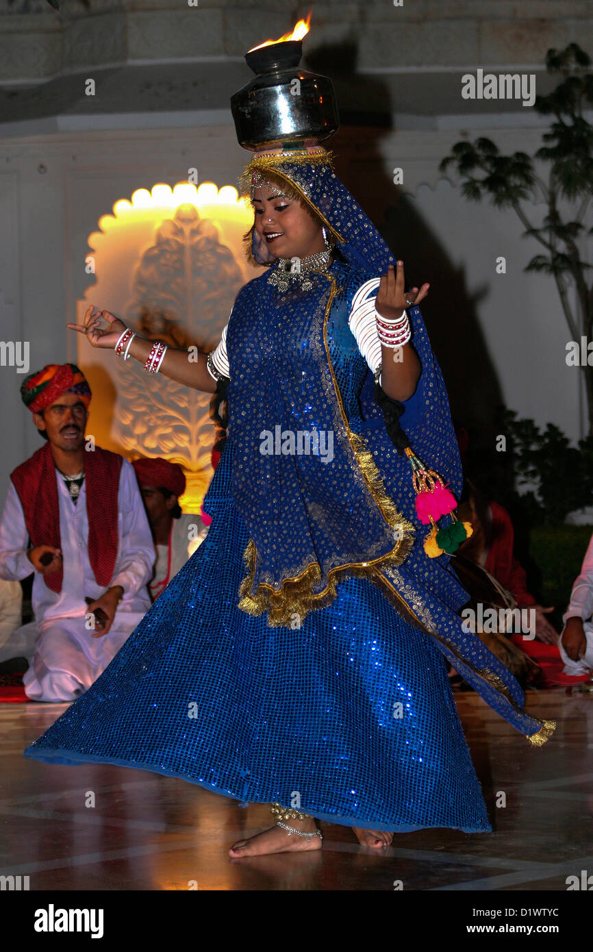 A colourful Rajasthani dancer performing a traditional folk dance at