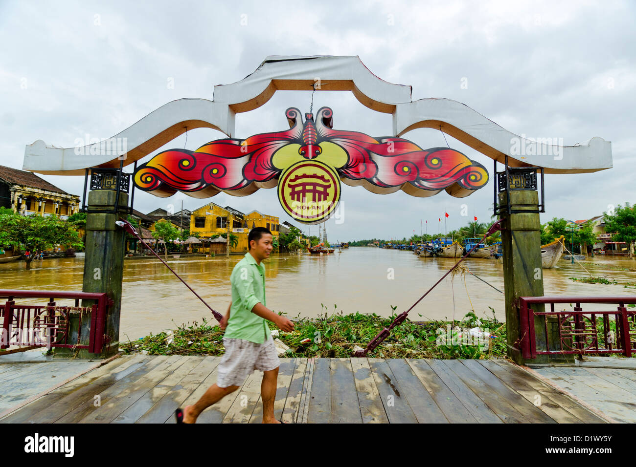 Vietnamese Man Walks Thu Bon River Breaks Following Flooding, Hoi An, Vietnam Stock Photo