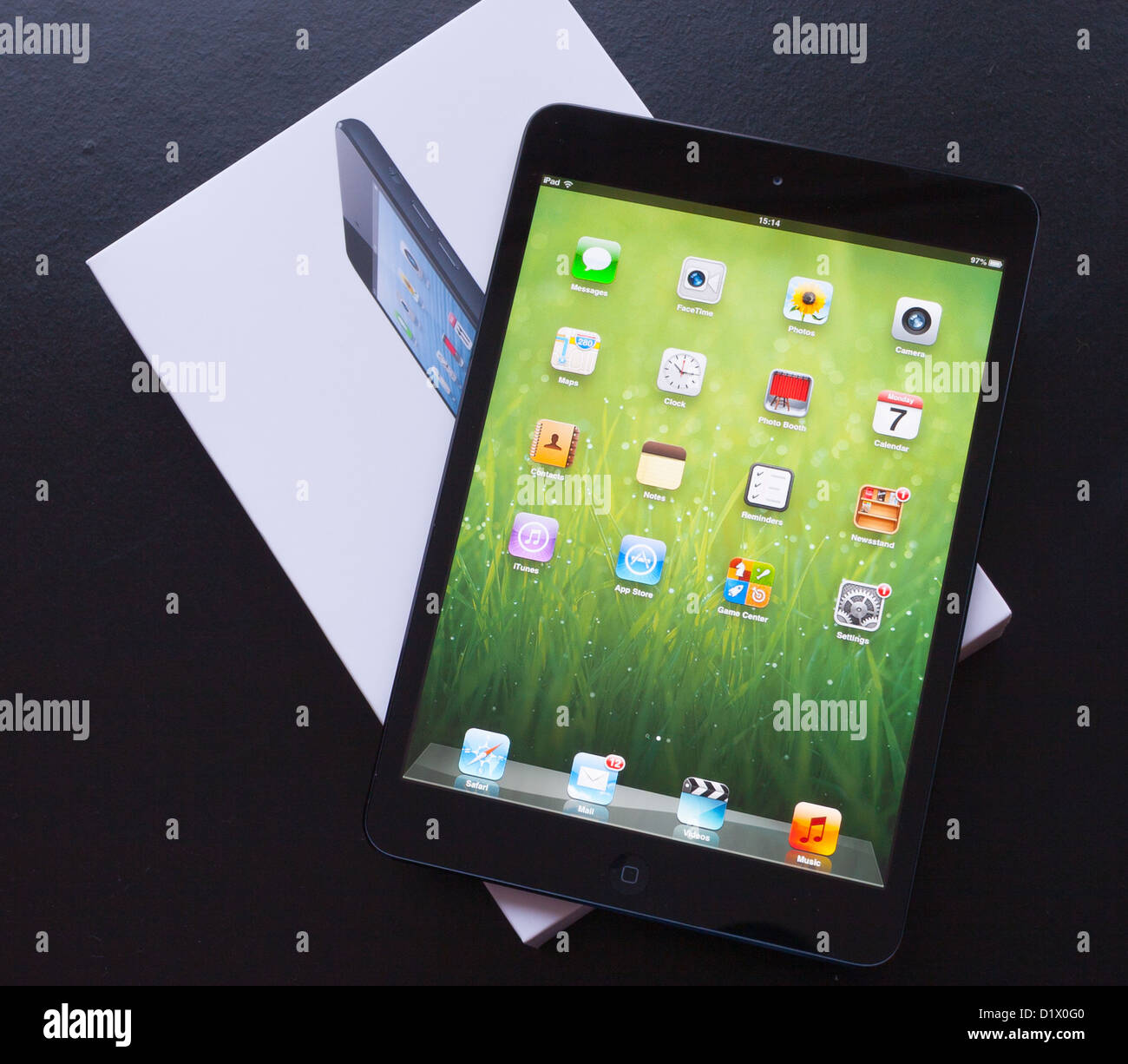 A brand new Apple iPad Mini lies on it's box Stock Photo