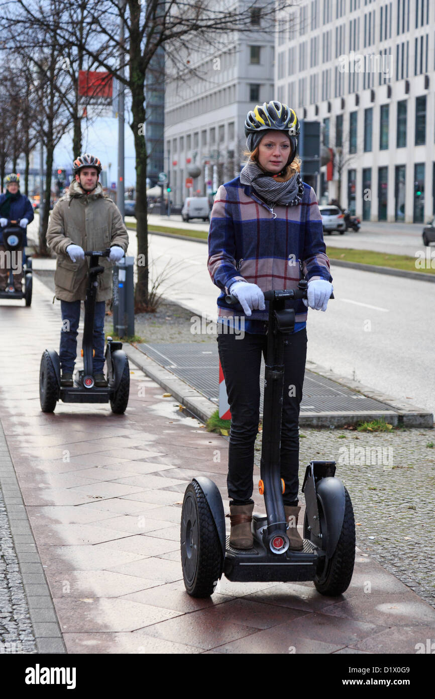 Tourists on a city tour riding on Segway i2 transporters along Ebertstrasse, Berlin, Germany, Europe. Stock Photo