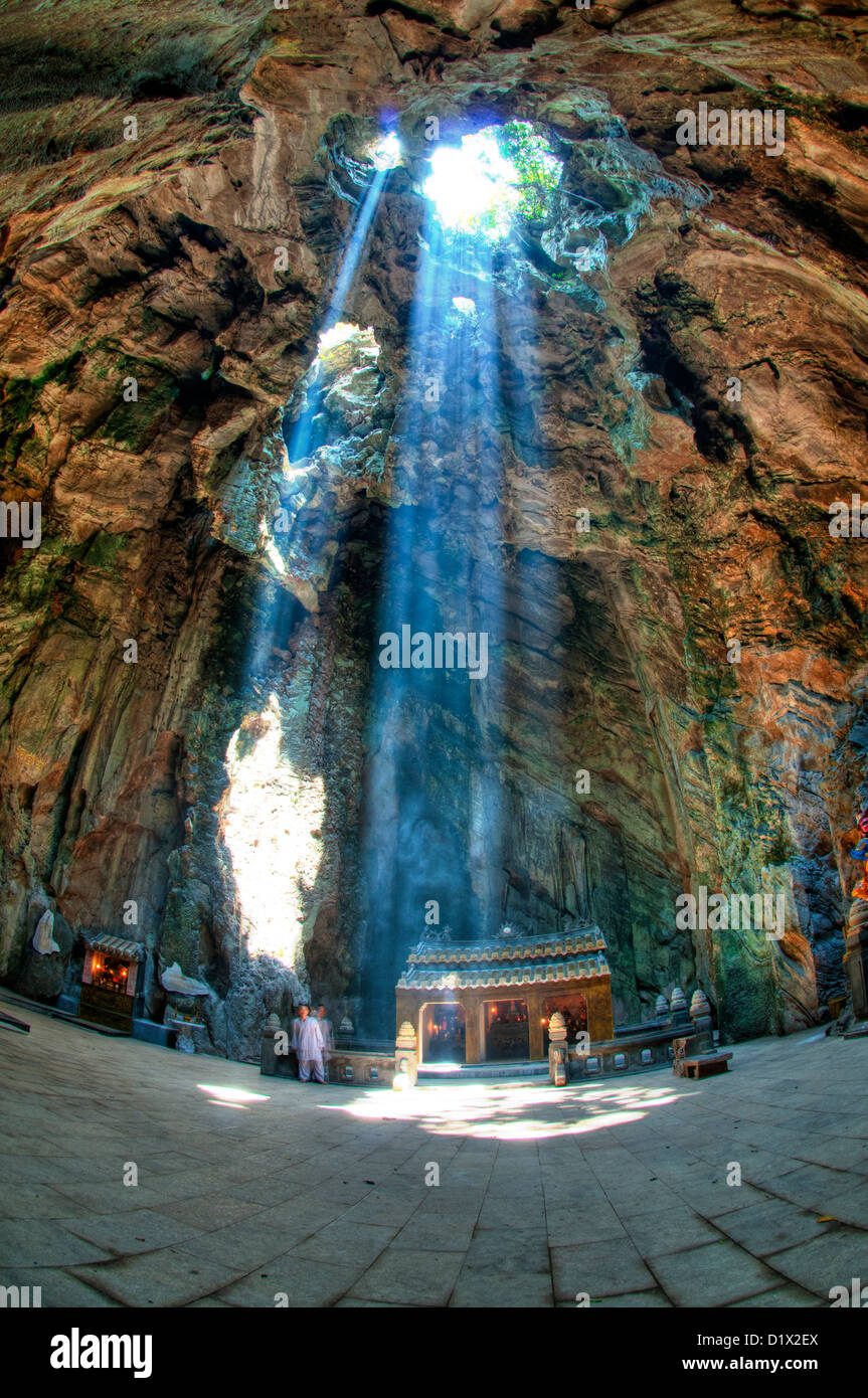 Marble Mountains, ray of light illuminating Huyen Khong cave. Danang, Vietnam Stock Photo