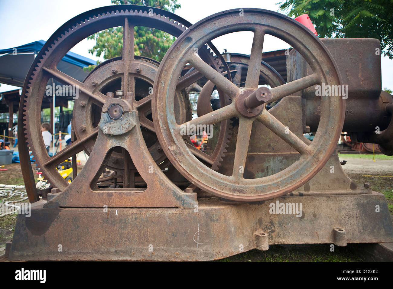 massive gears on antique gasoline engine Stock Photo