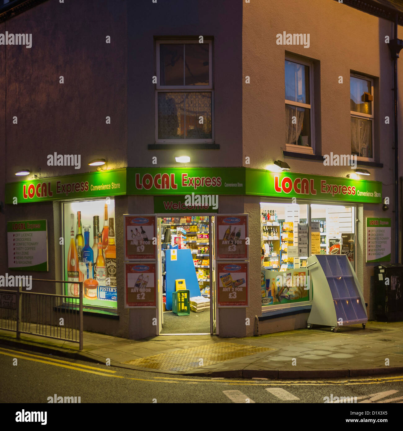 A Local Express corner shop store exterior night UK Stock Photo Alamy