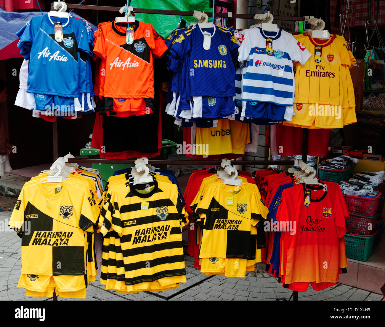 Fake football shirts on sale  in Malaysia for QPR, Cardiff City and the Malaysian national team Stock Photo