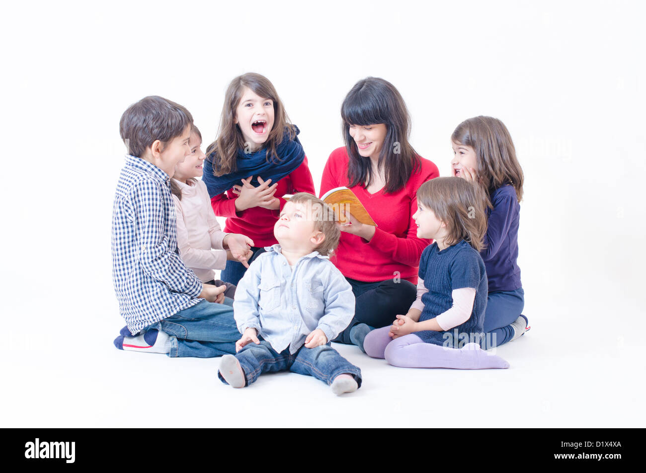 Mother tells a story to her large family Stock Photo