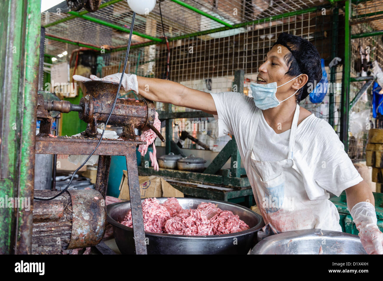 Man handmaking mince meat, Carbon market, Cebu, Visayas, Philippines