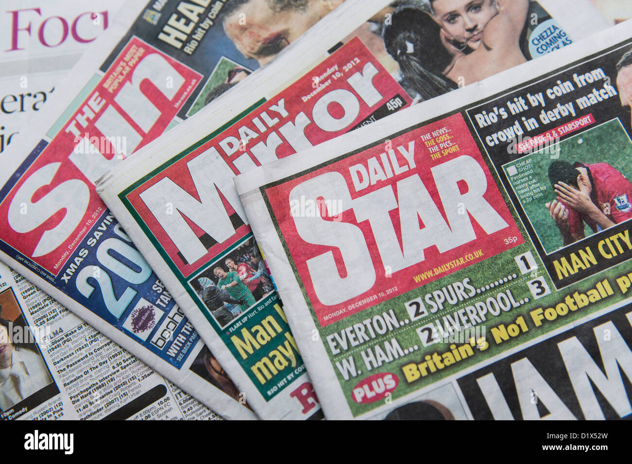 The front pages and mastheads of UK 'Red Top' tabloid tabloids Sun Star Mirror British English daily national newspapers Stock Photo