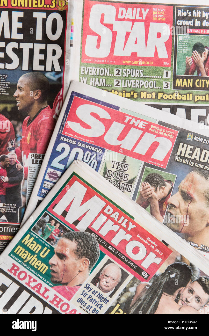 The front pages and mastheads of UK 'Red Top' tabloid tabloids Sun Star Mirror British English daily national newspapers Stock Photo