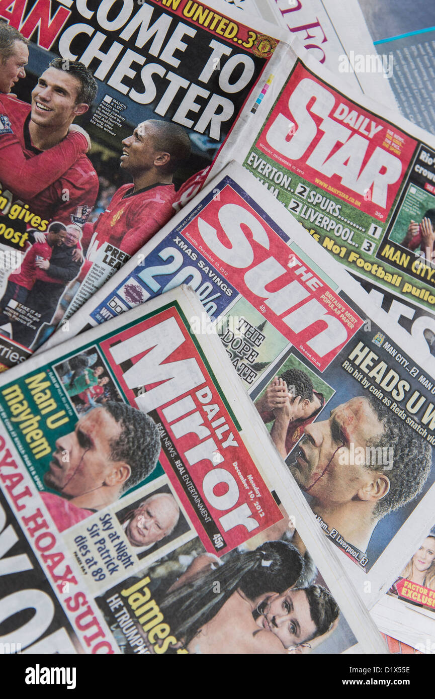 The front pages and mastheads of UK 'Red Top' tabloid tabloids Sun Star Mirror British English daily national newspapers Stock Photo