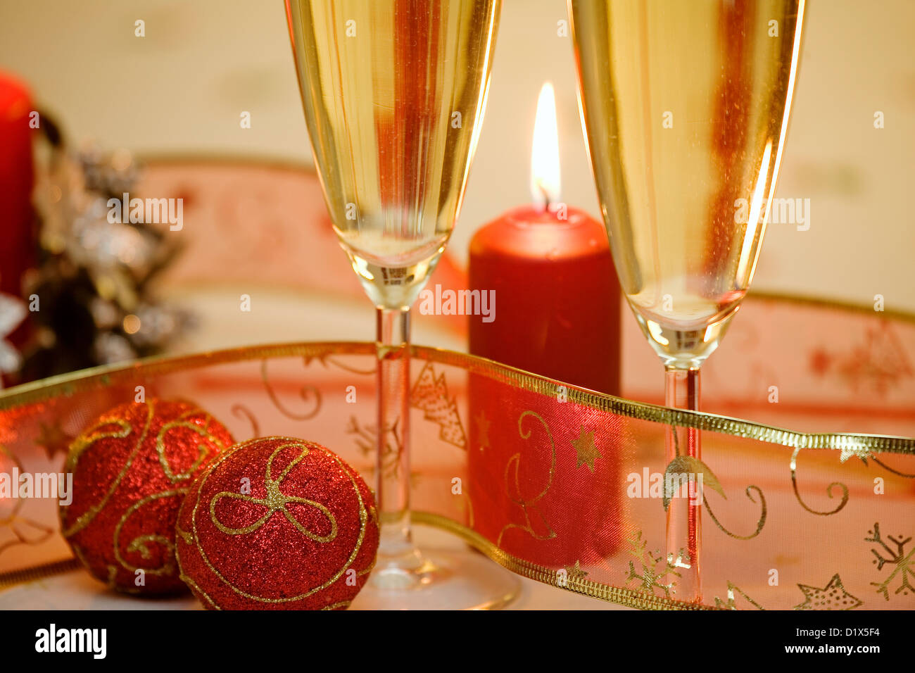 Champagne and Christmas Ornaments Candles Stock Photo