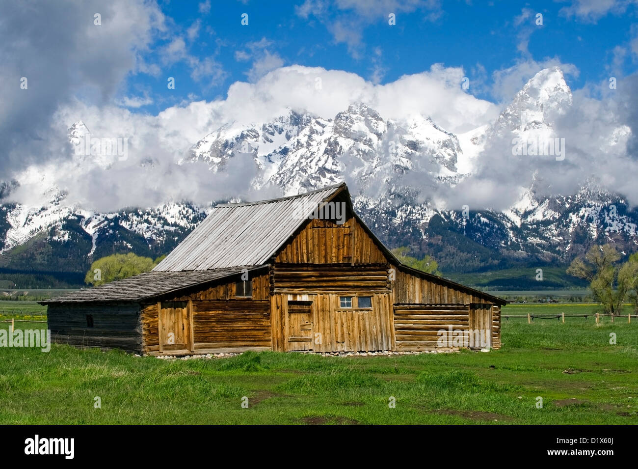 A historic barn on Mormon Row in Grand Teton National Park with dramatic clouds, Wyoming. Stock Photo