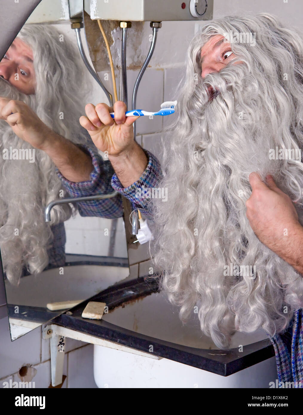 man cleans teeth Stock Photo