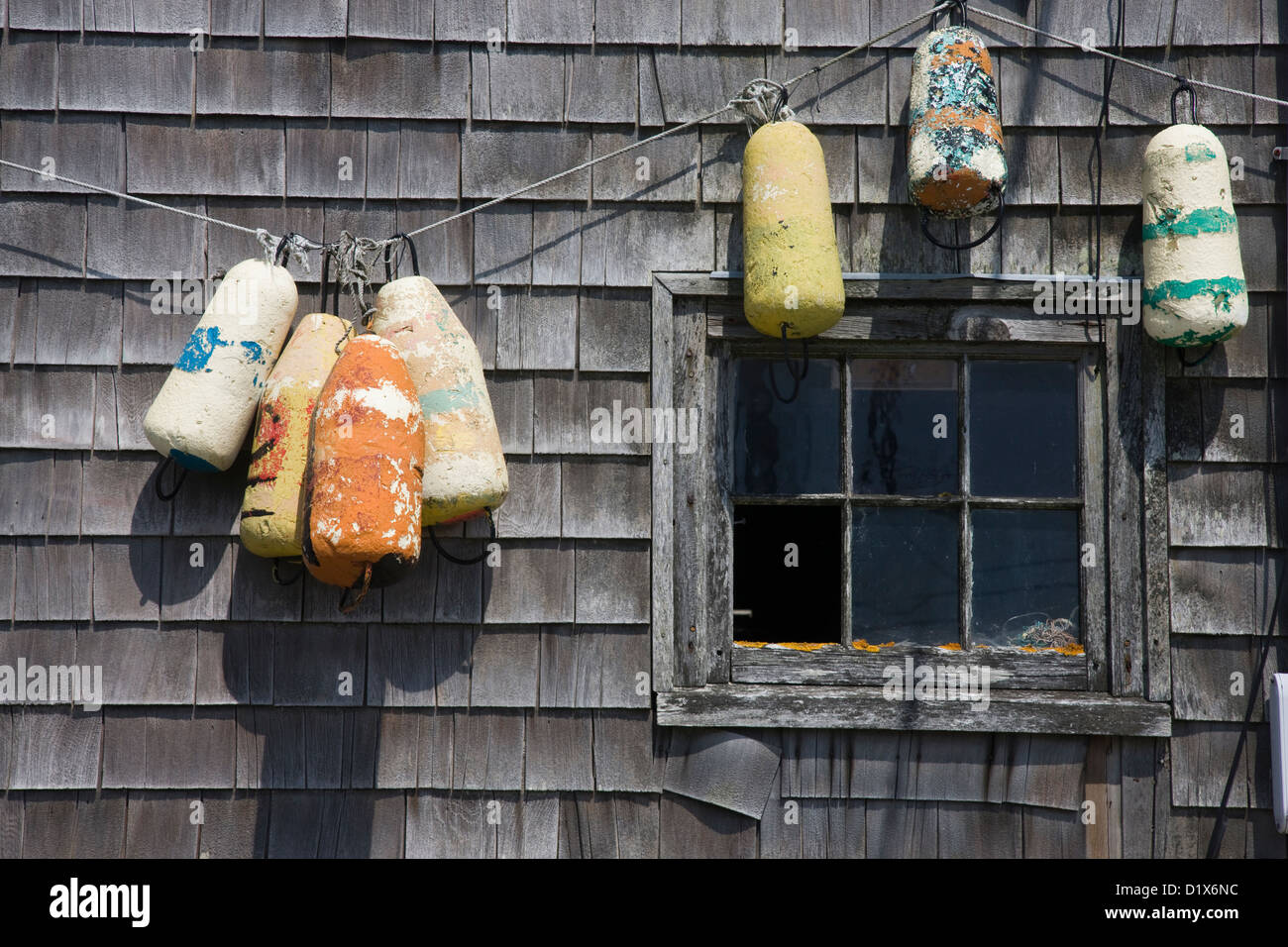 Fishing floats and buoys on a fisherman's shed in Peggy's Cove Stock Photo