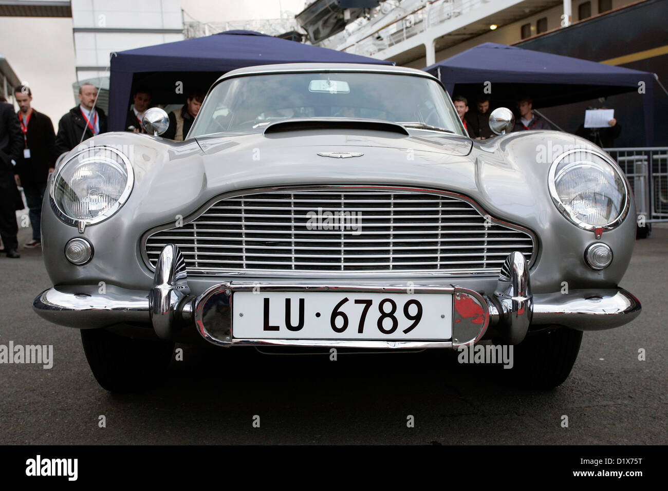 The original James Bond Aston Martin DB5 (sporting Swiss number plates) parked next to the Royal Yacht Britannia Stock Photo
