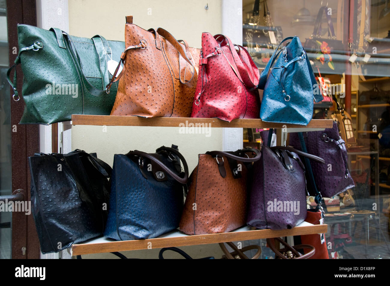 Different kind of leather purse bags colorful vibrant colors selling in the  Italian market shop Stock Photo by ©olena.sakhatska 289501334