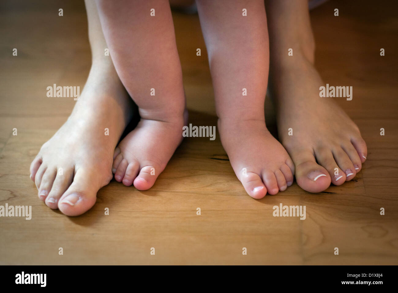 Mum and baby feet Stock Photo