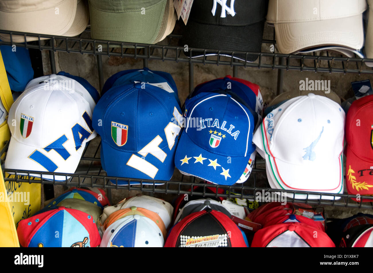 A rack of Italian baseball caps on sale in a small town of Garda on Lake Garda in the Veneto region of northern Italy Stock Photo