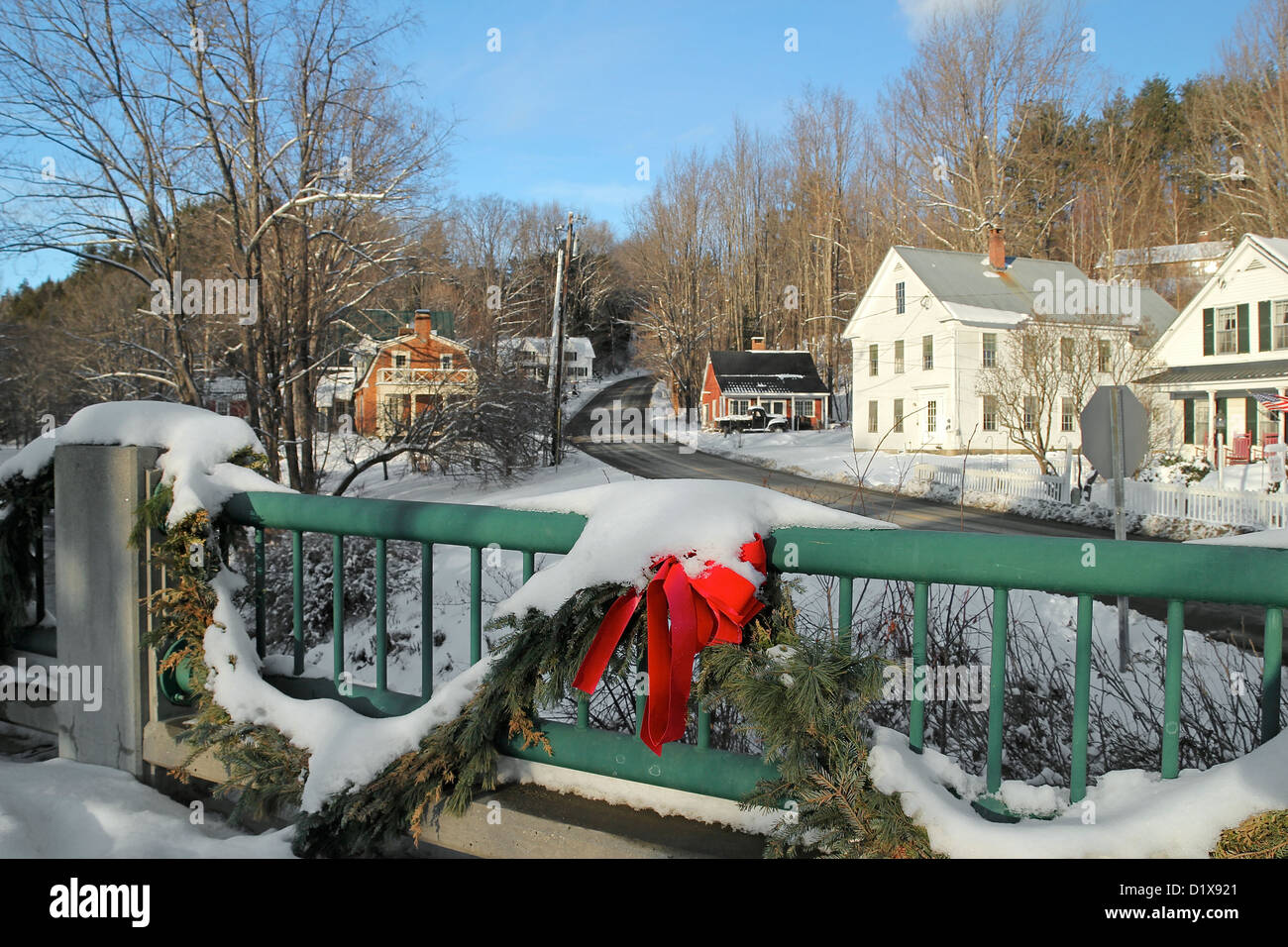 On a bridge in wintertime, looking towards homes in the small Vermont town of Grafton Stock Photo