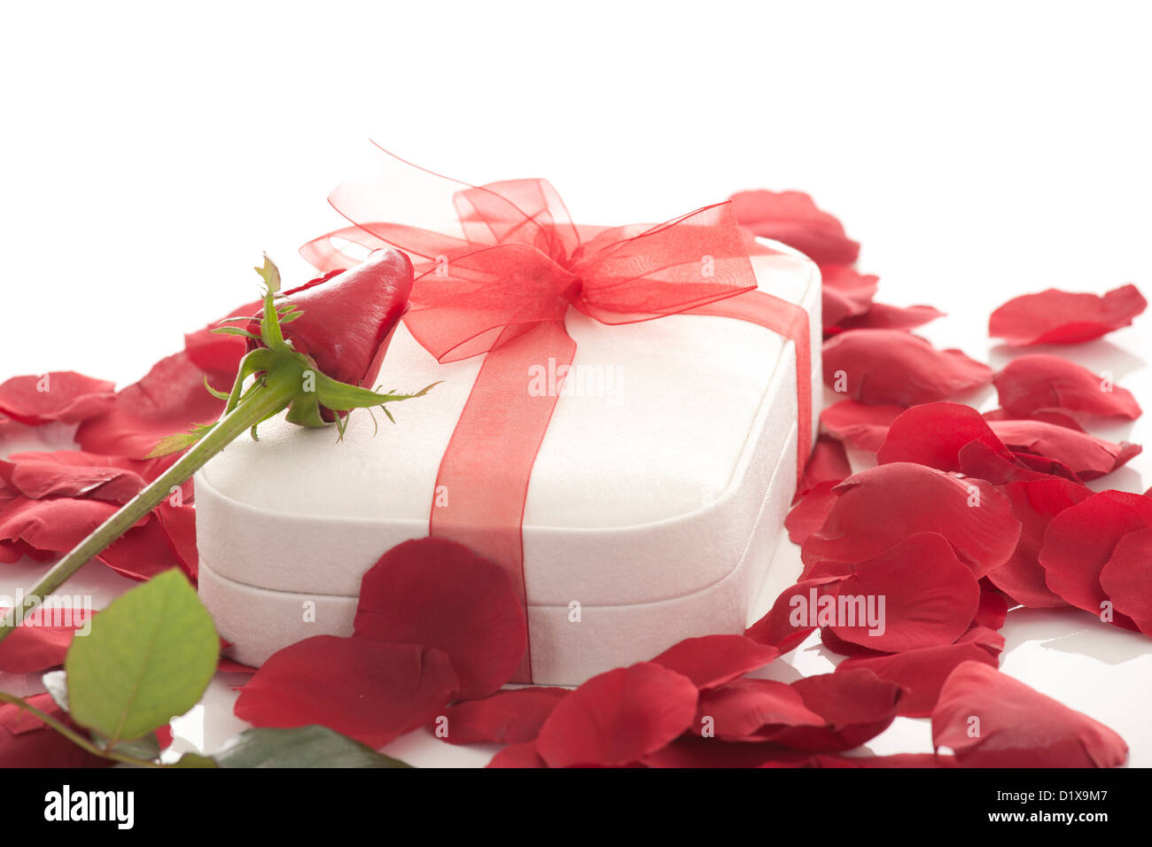 Valentines Day gift in red box with rose petal isolated on white Stock ...