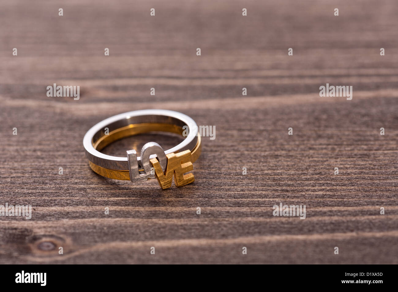 Engagement ring on wooden table, for Valentines Day or other romantic