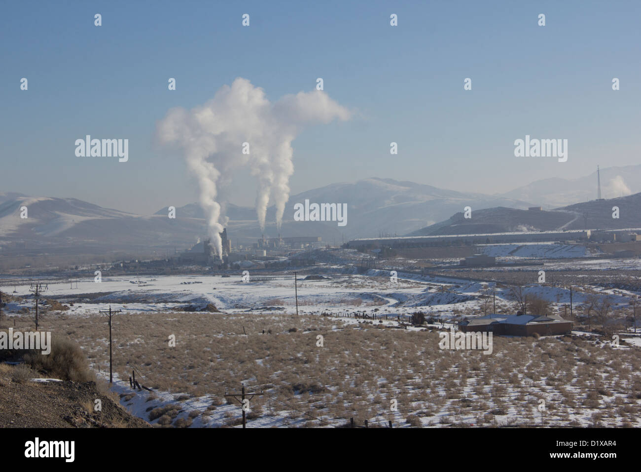 Power Plant smokestacks with blue skies and mountains Stock Photo - Alamy