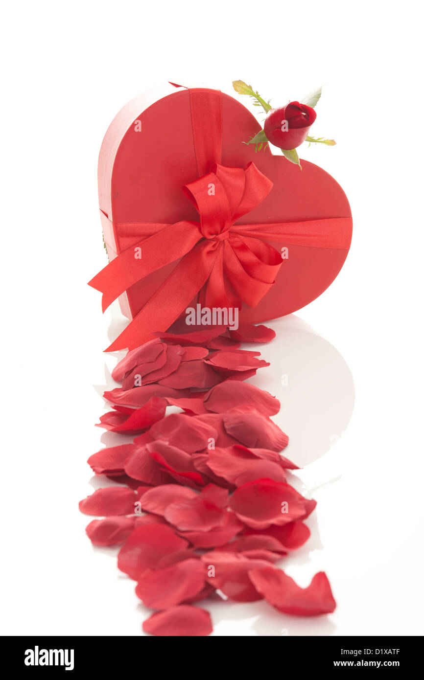 Valentines Day gift in red box with rose petal isolated on white Stock ...