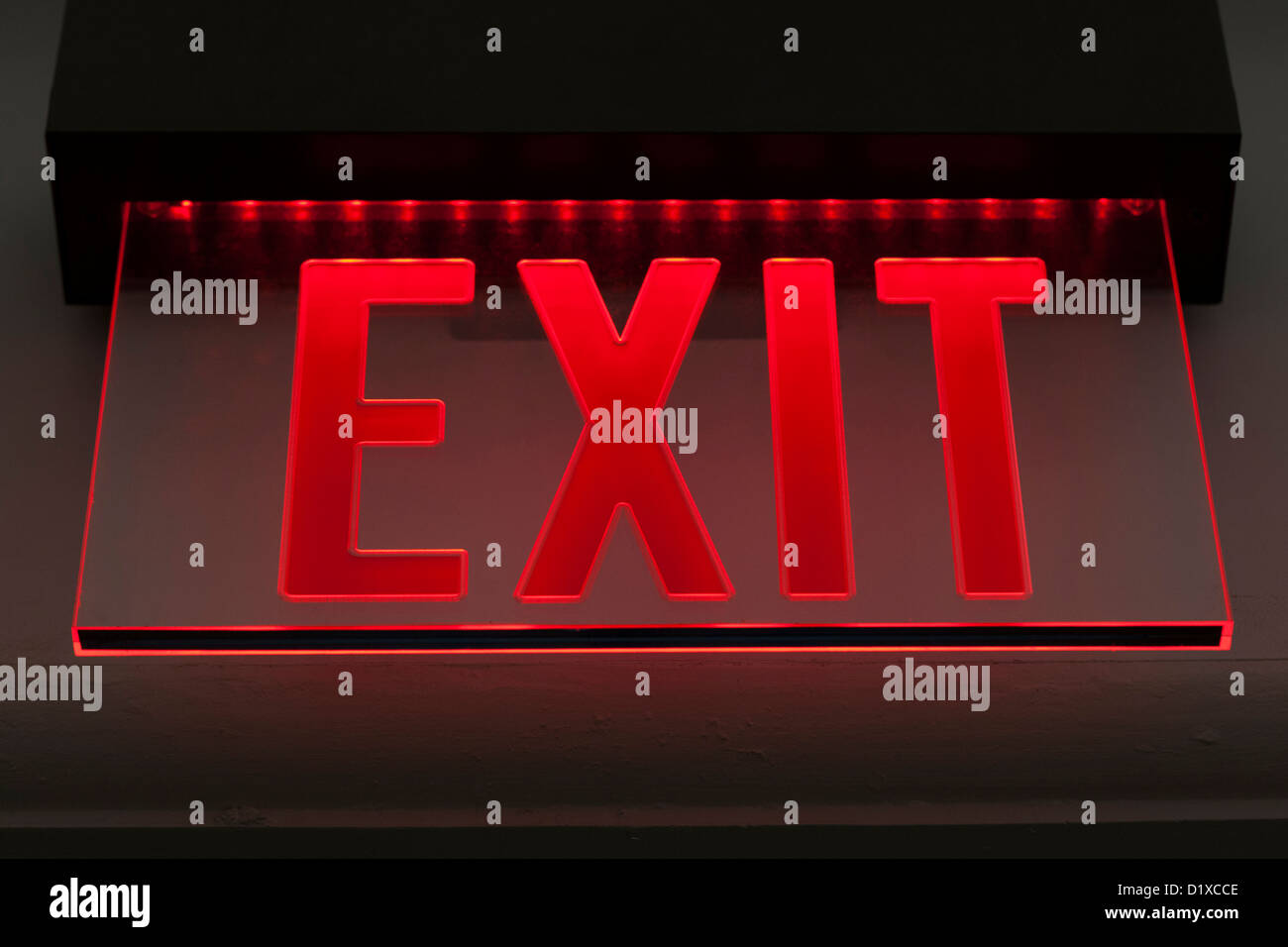 Red illuminated exit sign Stock Photo