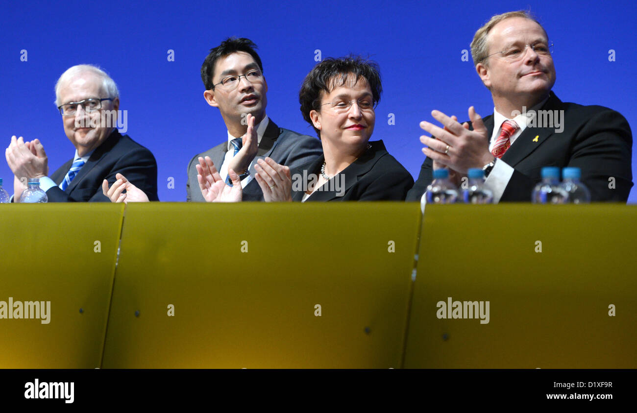 The chairman of the FDP's parliamentary fraction, Rainer Bruederle (L-R), chairman of the FDP, Philipp Roesler, vice chairwoman Birgit Homburger and German Minister for Economic Cooperation and Development Dirk Niebel applaude during the annual Epiphany party conference of the FDP in Stuttgart, Germany, 6 January 2013. Photo: Bernd Weißbrod Stock Photo