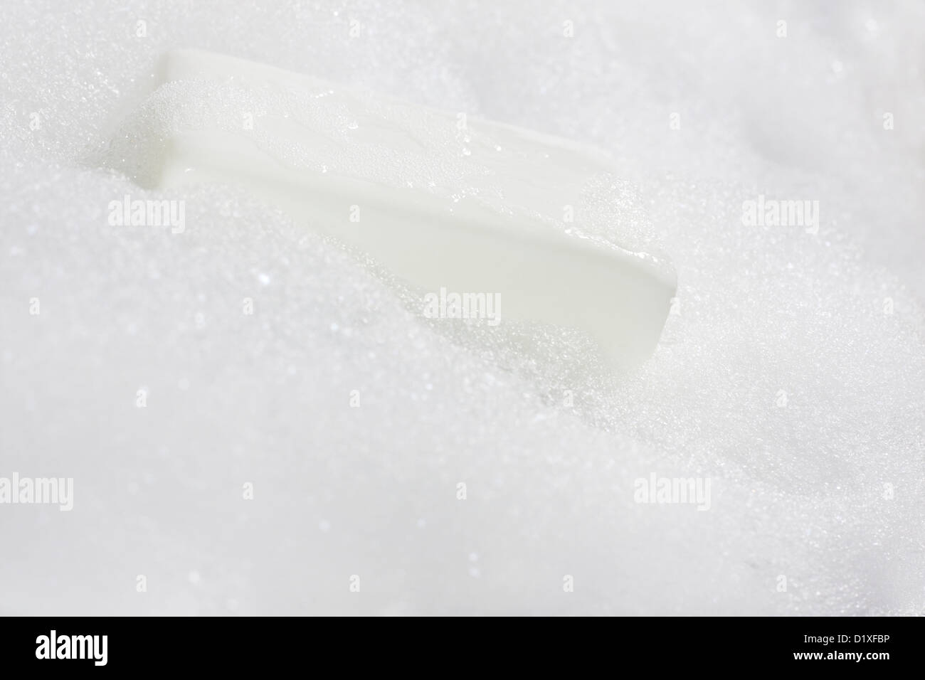 Foam with soap in the bath on white Stock Photo