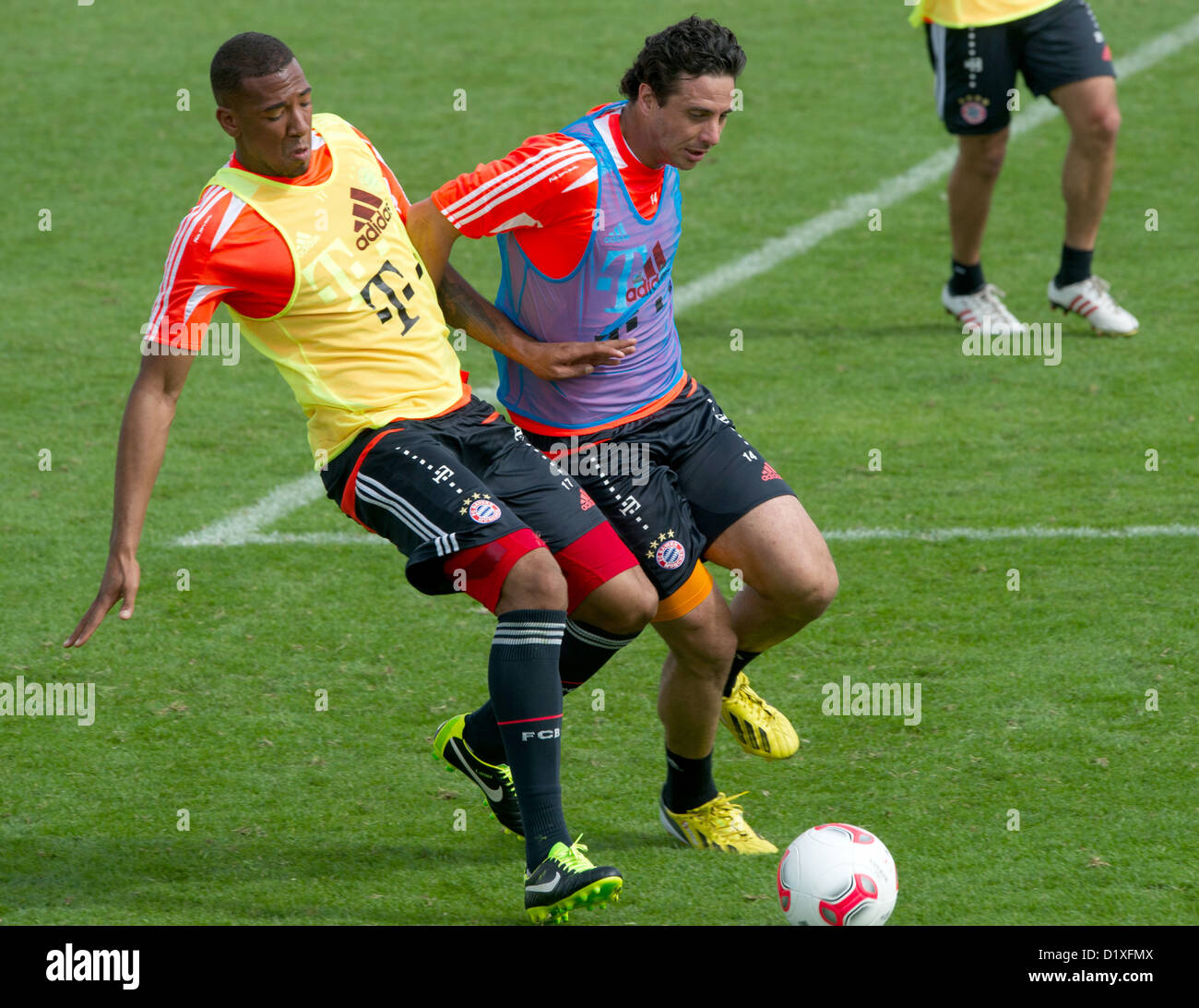 FC Bayern Muenchen's Jerome Boateng (L) and Claudio Pizarro vie for the ball during the training camp in Doha, Qatar, 07 January 2013. FC Bayern Muenchen stays in Qatar until 09 January 2013. PHOTO: PETER KNEFFEL Stock Photo