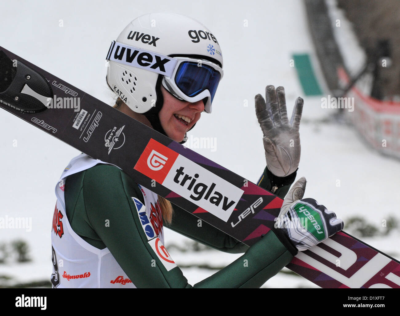 Slovenian ski jumper Katja Pozun cheers at the finishing line after the
