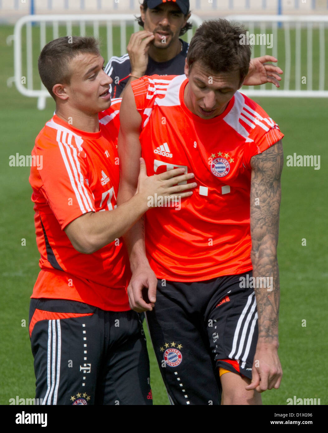 FC Bayern Muenchen's Xherdan Shaqiri (L) and Mario Mandzukic stand on the  pitch during the training camp in Doha, Qatar, 07 January 2013. FC Bayern  Muenchen stays in Qatar until 09 January