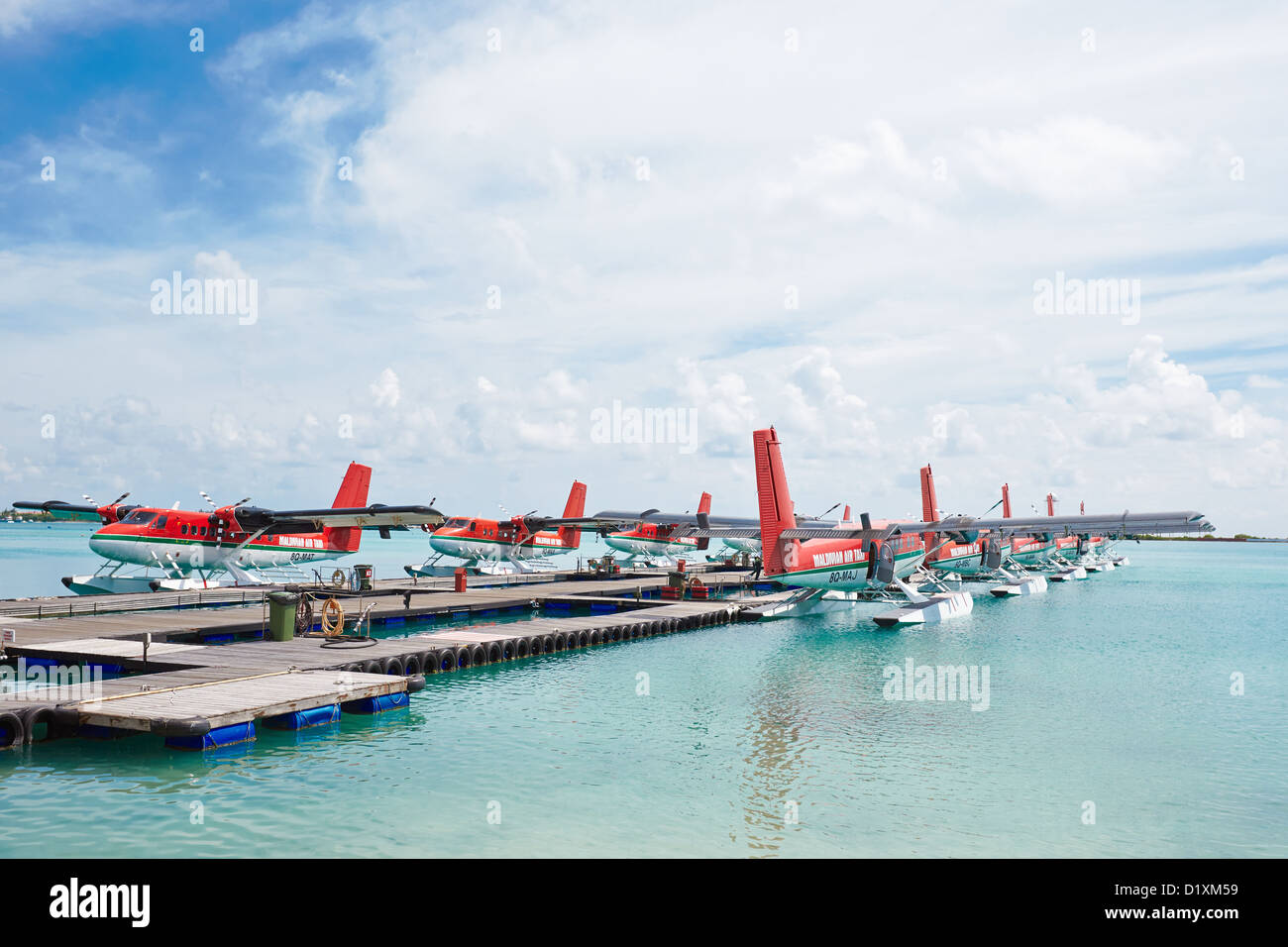 Maldivian Air Taxi seaplanes at the Malé International Airport terminal ...