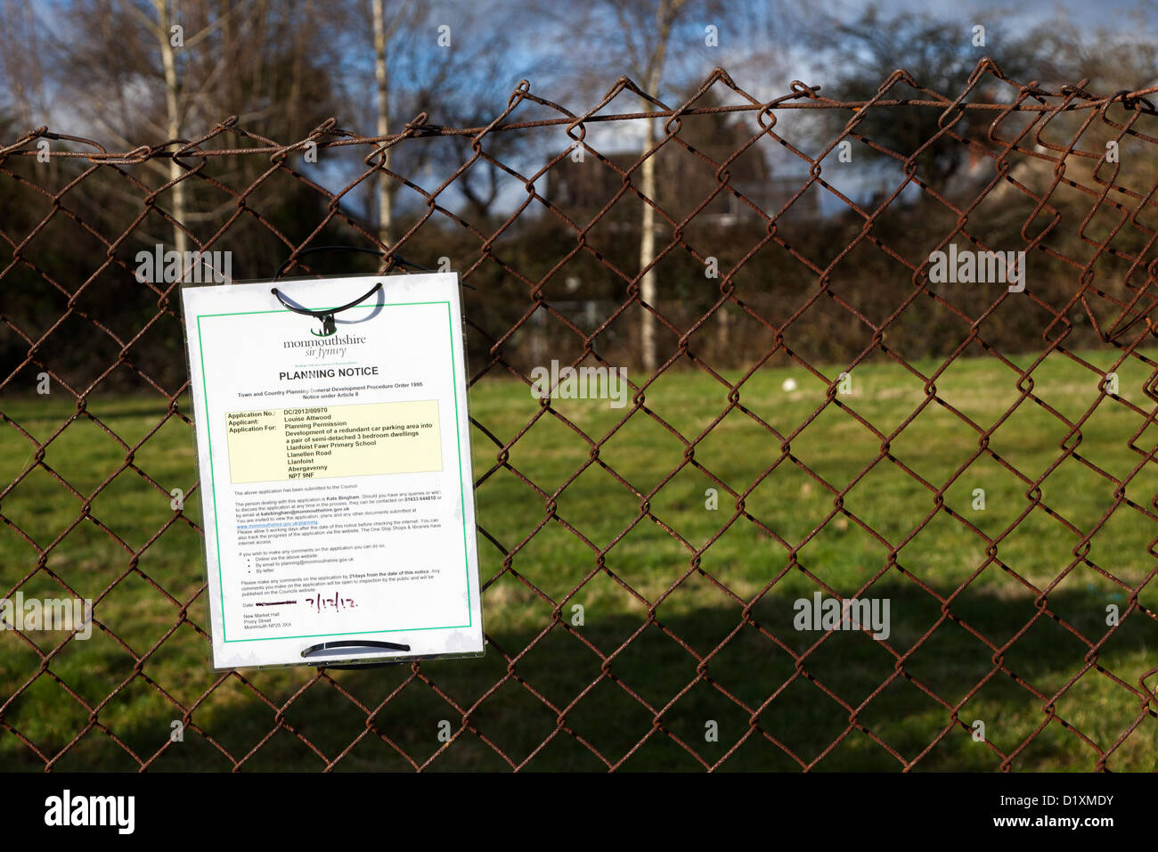 Planning permission notice on fence concerning proposed infill housing
