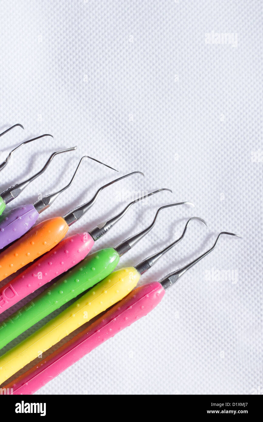 Collection of colorful dental scalers used in dental hygiene and