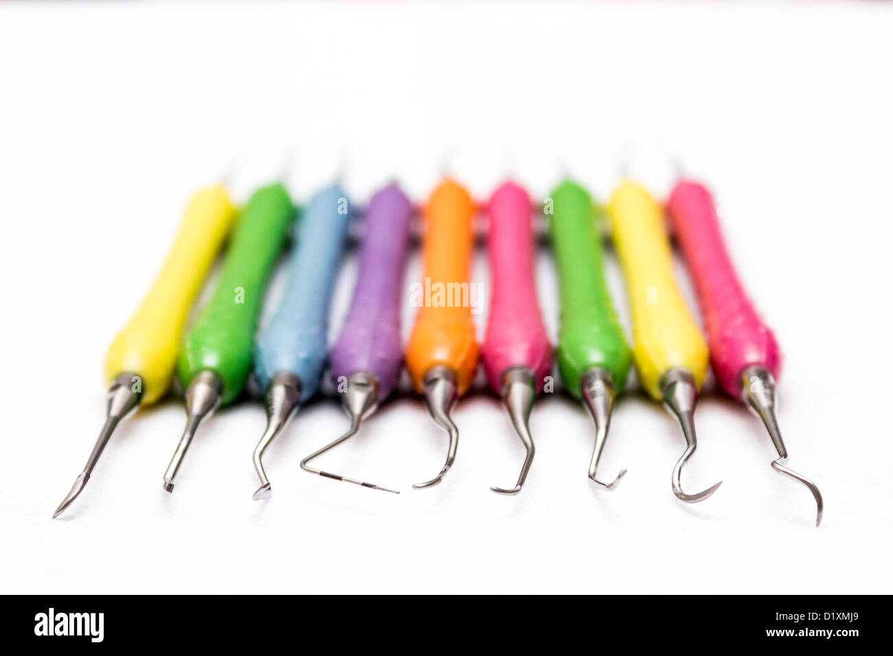 Collection of colorful dental scalers used in dental hygiene and