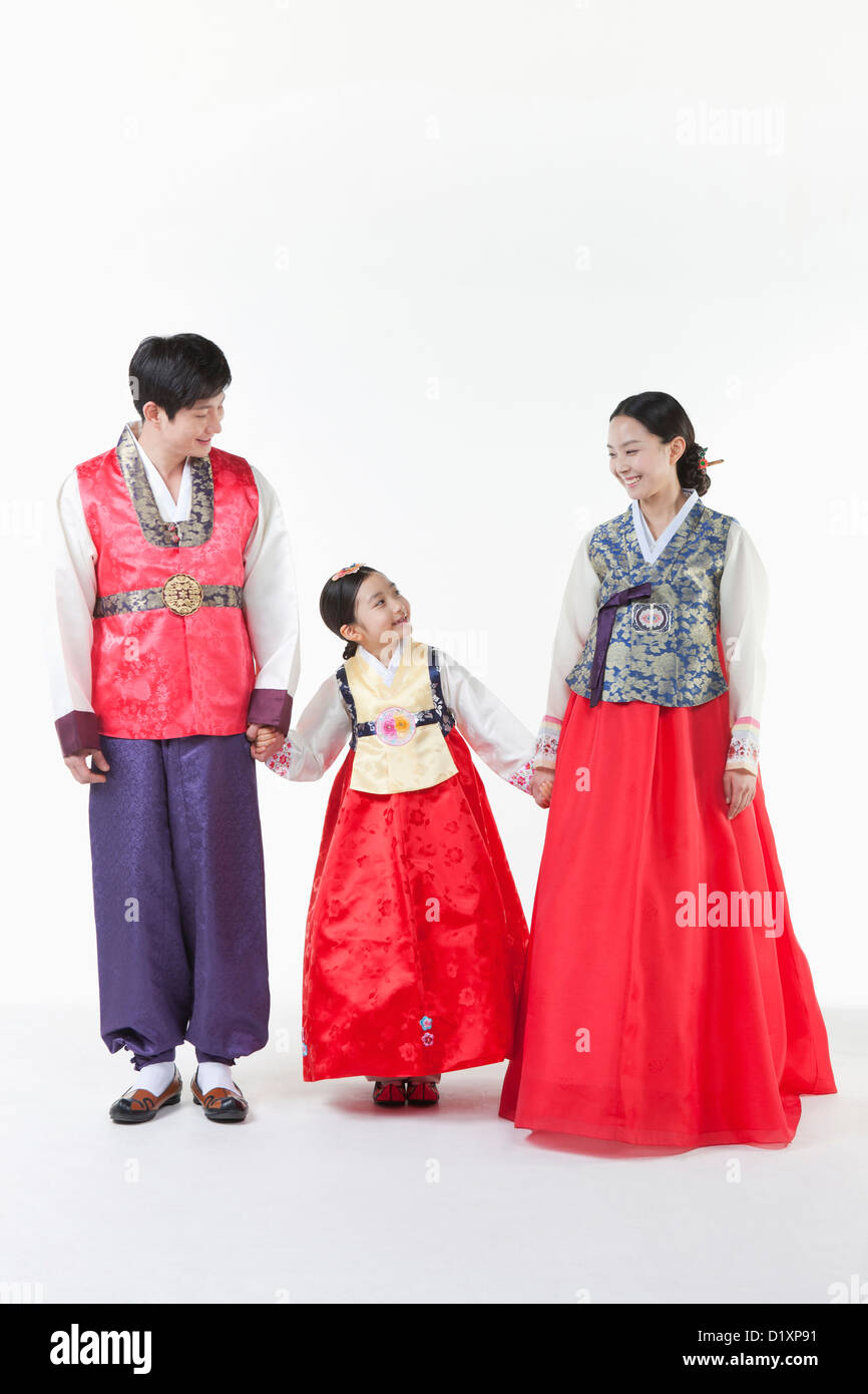 a family looking at each other wearing Hanbok Stock Photo - Alamy