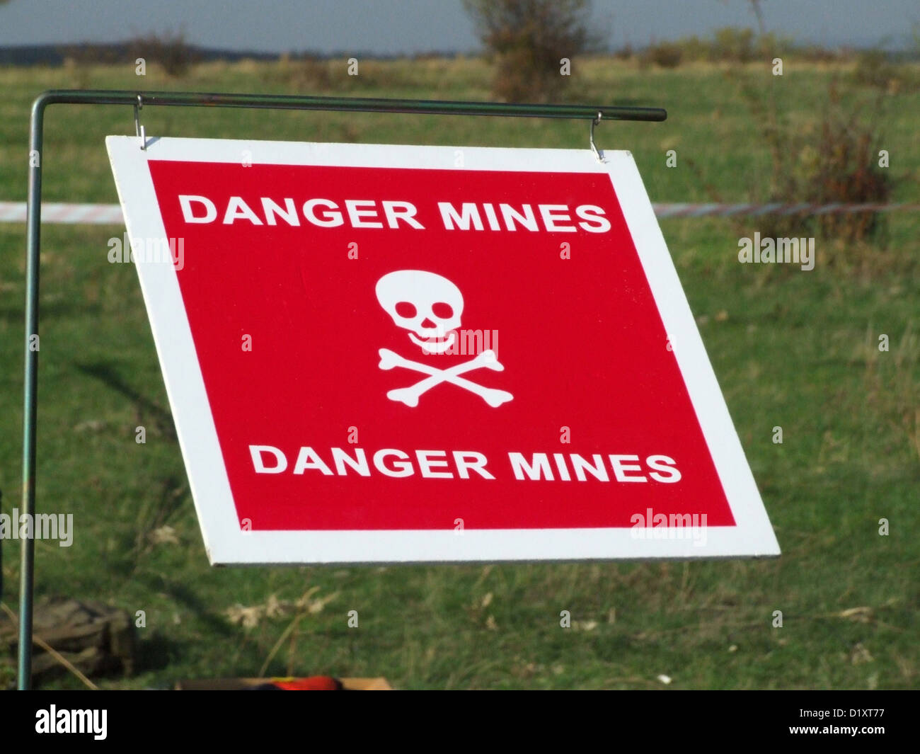 Warning sign on mined area Stock Photo