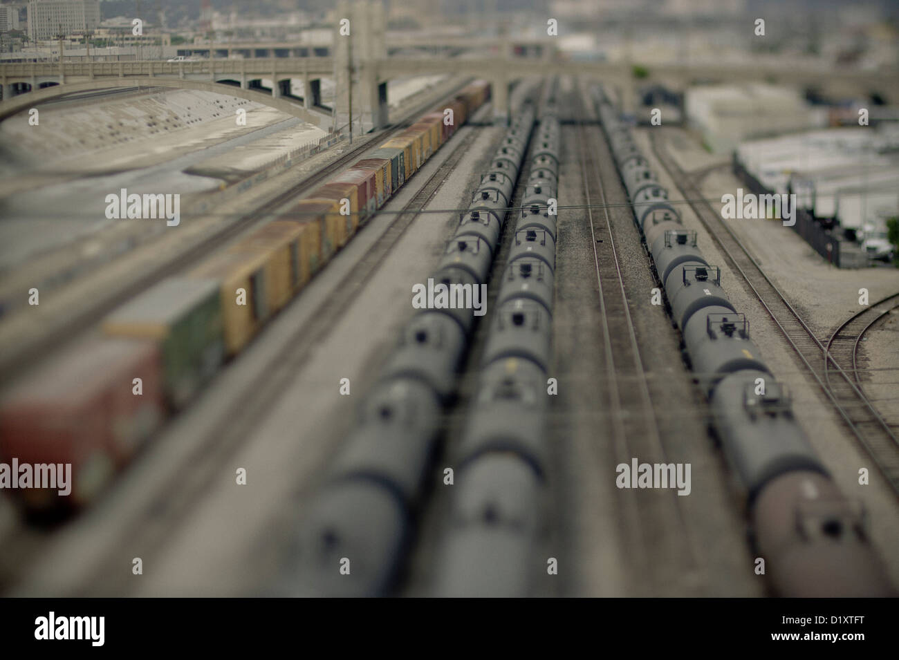 Cargo and containers stationery on a rail track, by the side of the L.A. River, California, USA Stock Photo