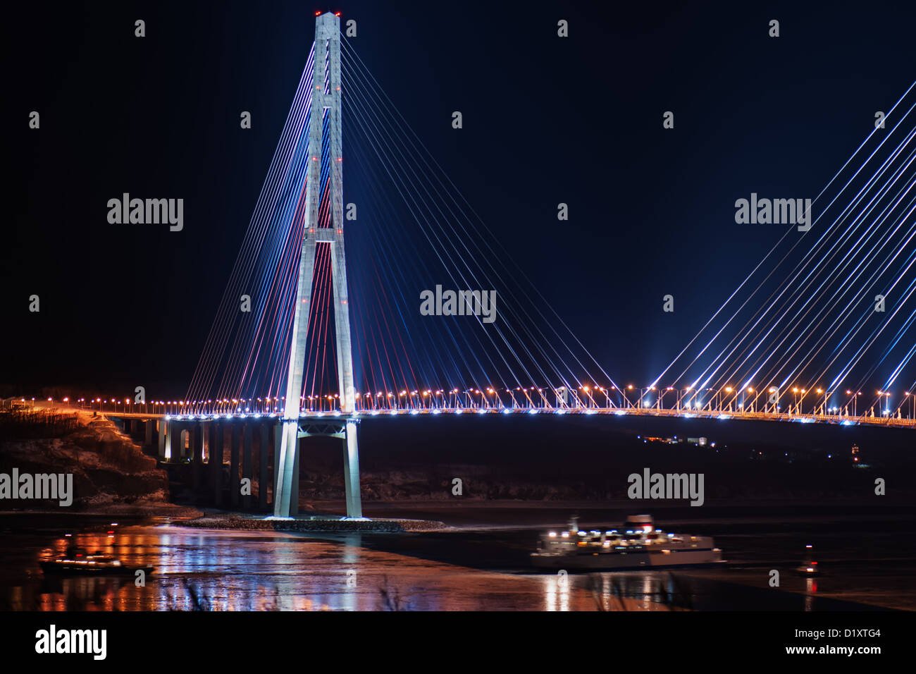 night view of the longest cable-stayed bridge in the world in the Russian Vladivostok over the Eastern Bosphorus strait Stock Photo