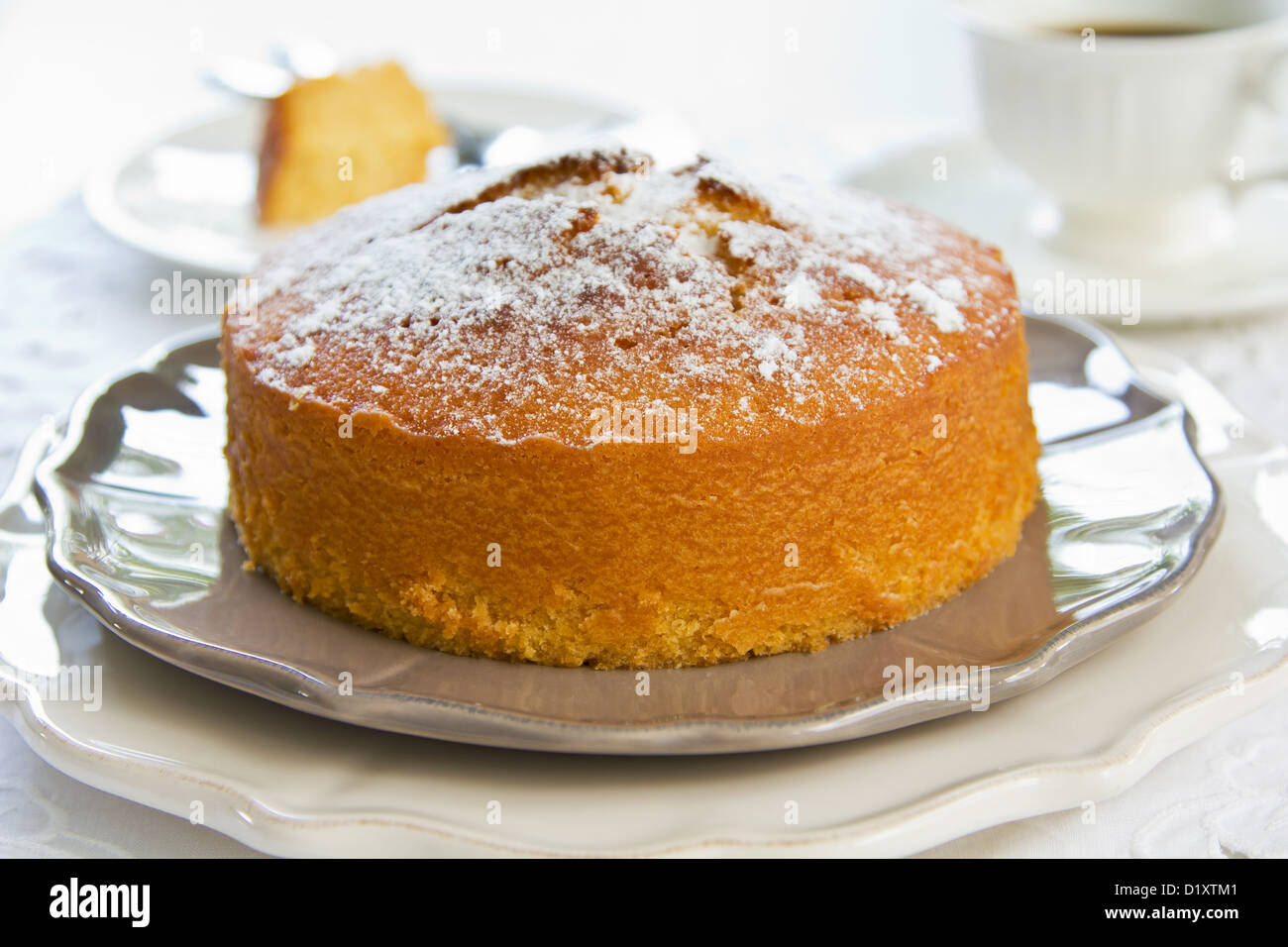 Butter cake with orange zest and juice by coffee Stock Photo Alamy