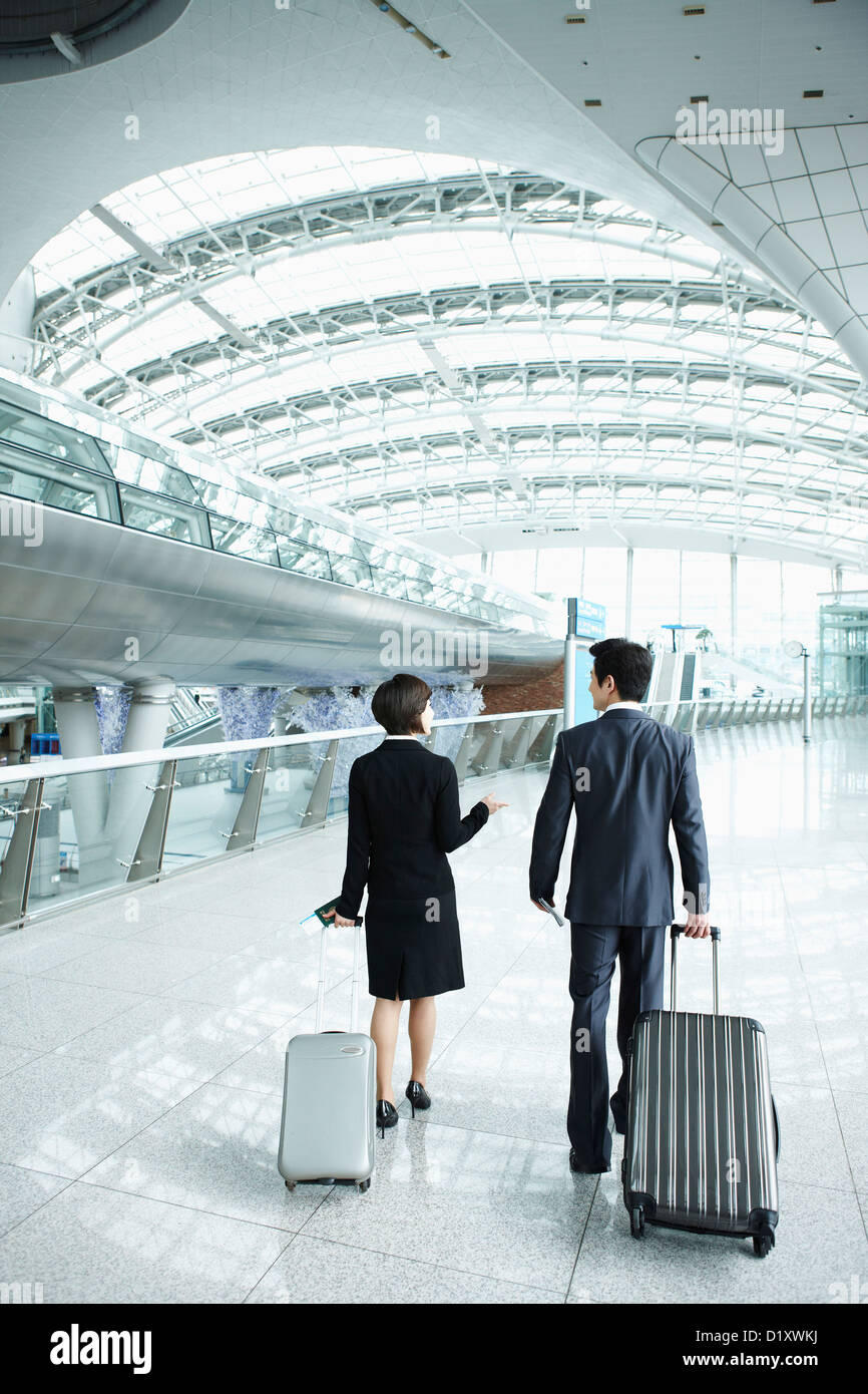 Man woman behind walking suit hi-res stock photography and images - Alamy
