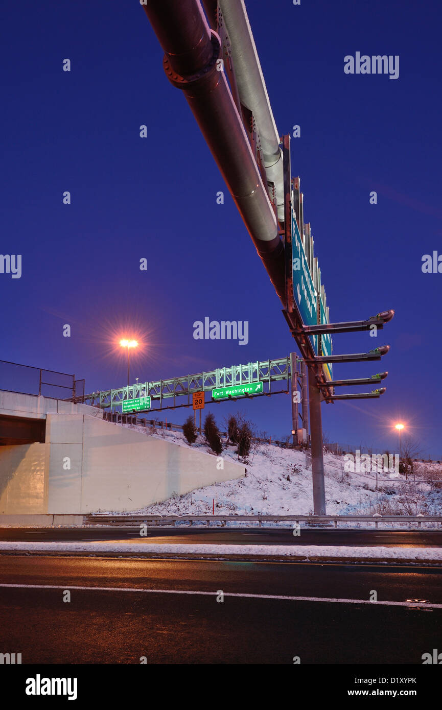 Under Highway Sign At Dawn In Winter Stock Photo