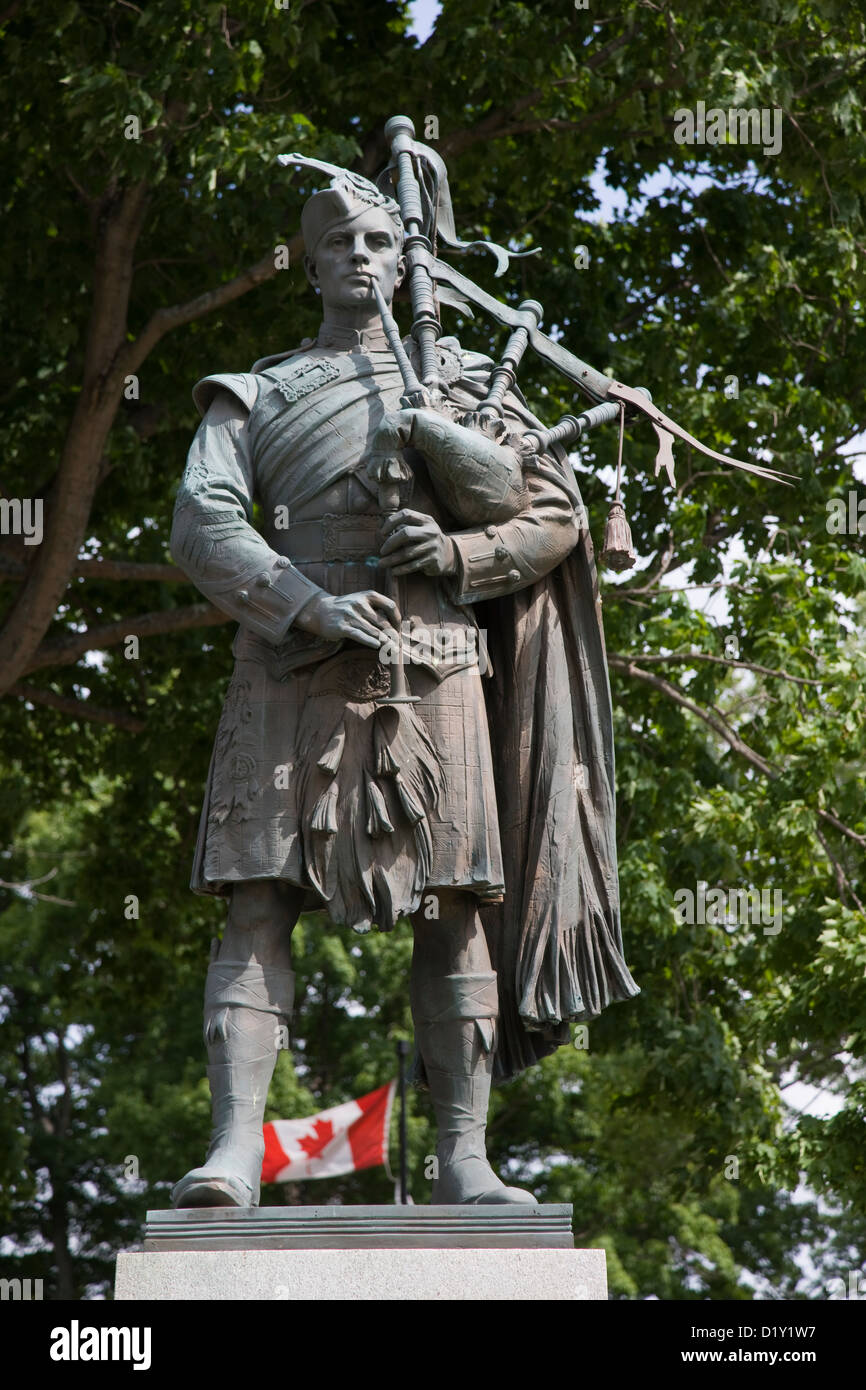War memorial of bronze Scottish bagpipe player in New Glasgow, Nova